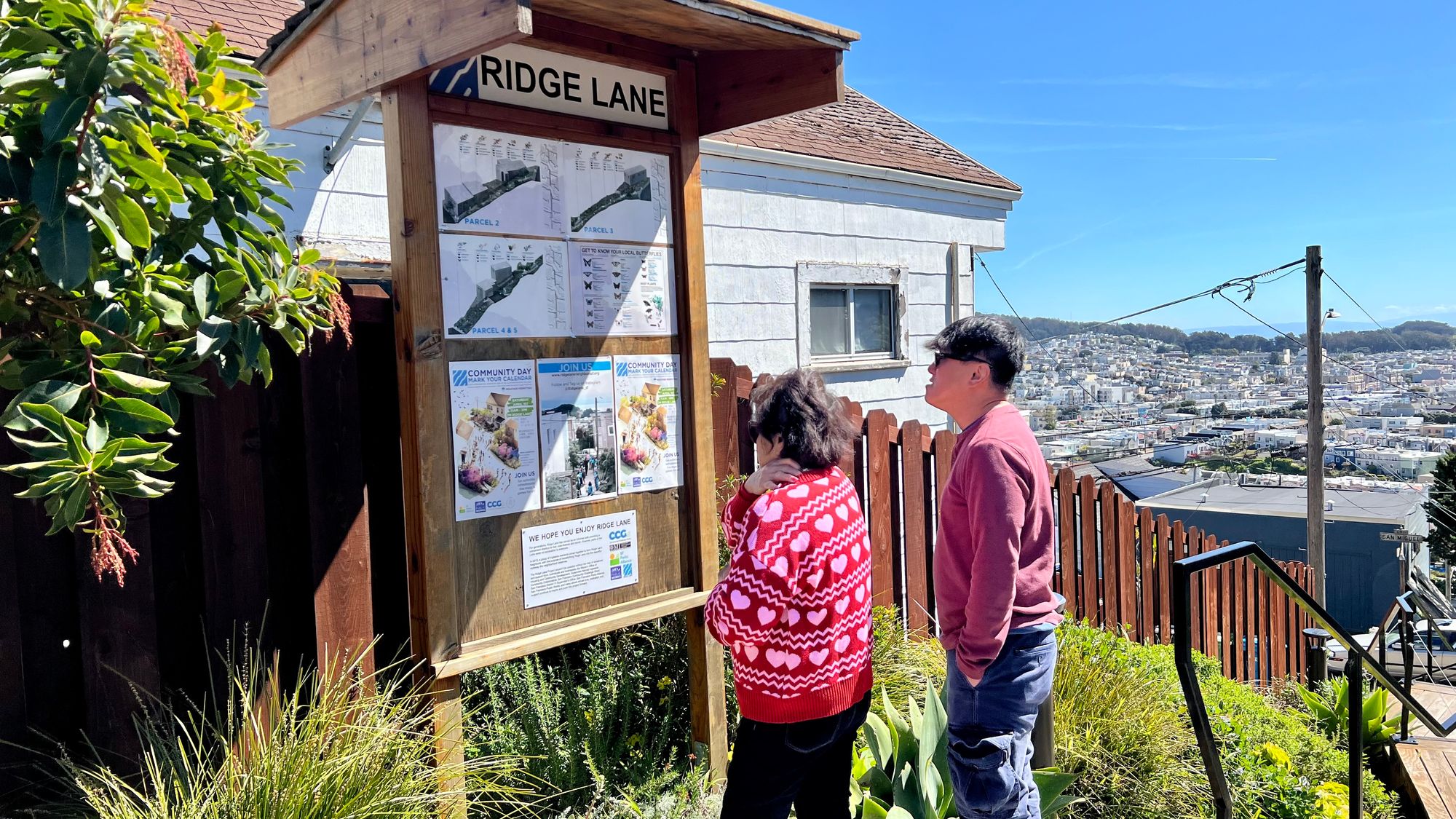 Neighbors inspect sign