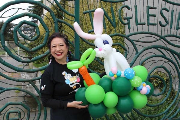 Woman holding balloon animal