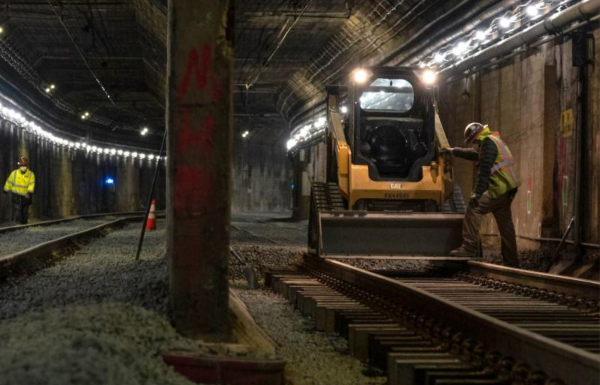 Construction workers in a tunnel.