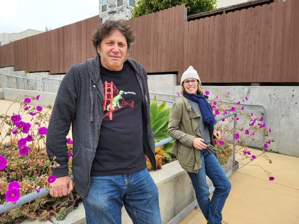 Volunteers pose for a photo at a garden.
