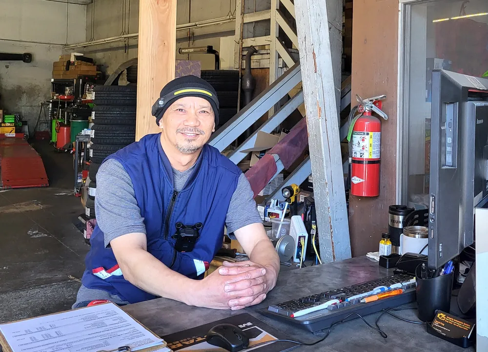 Man posing in garage.