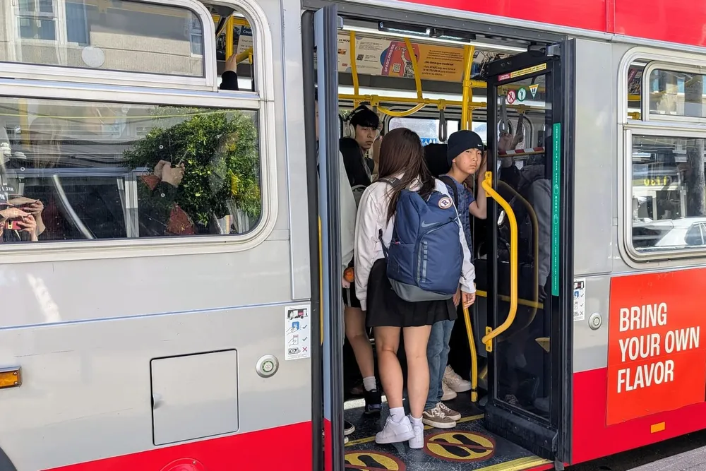 Bus passengers.