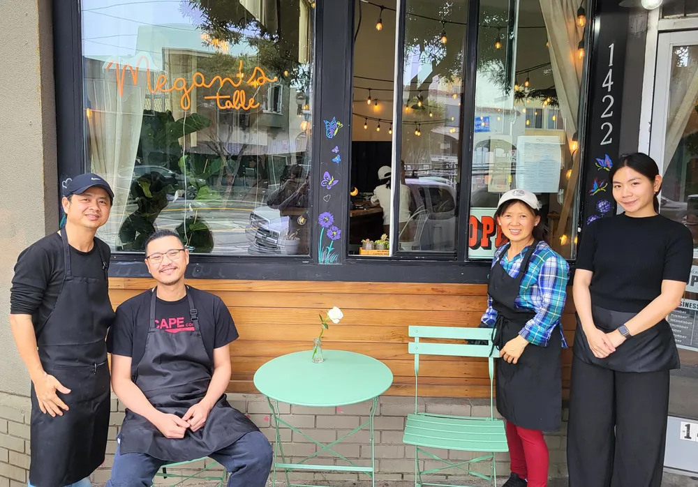 Restaurant staff posing for portrait.
