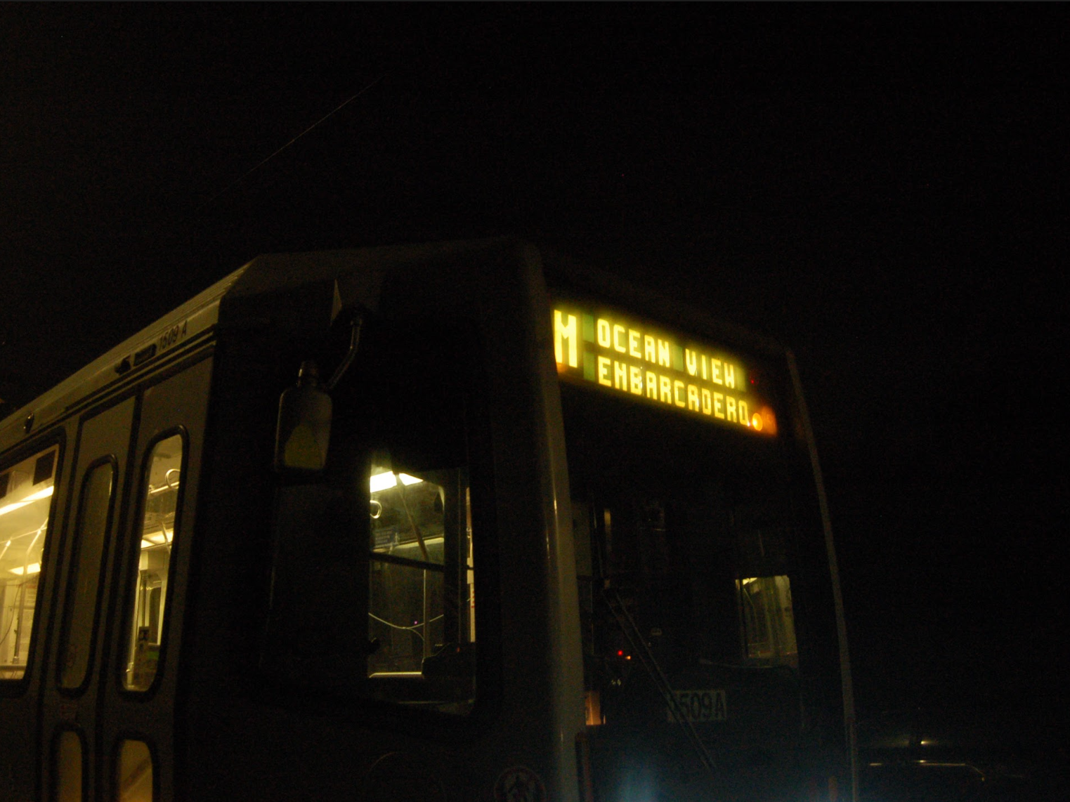 A streetcar's front at night.