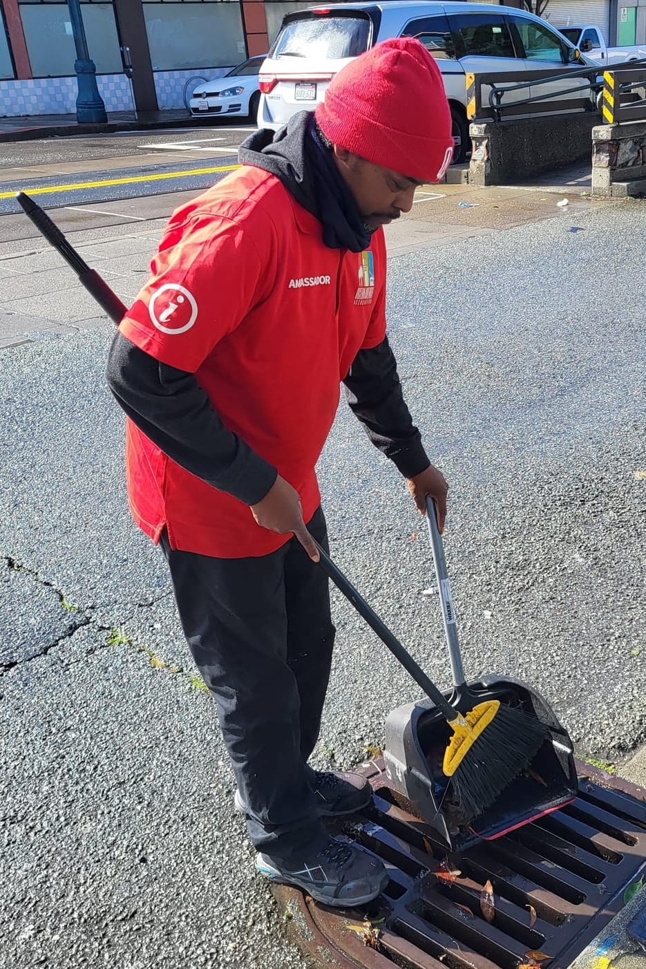 Man cleaning a gutter.