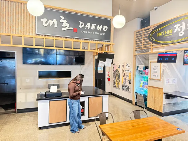 Woman at vacant food stall.