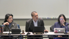 Three people at meeting