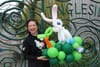 Woman holding a balloon Easter bunny