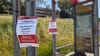 Bus stop with signs.