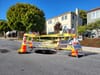 A sinkhole with caution tape around it.