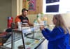 Woman at ice cream counter.