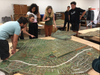 Volunteers around the San Francisco scale model.