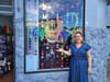 A businesswoman in front of her store.