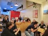 People chatting at cafe.