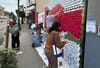 People painting a mural.