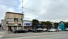 Street with four buildings.