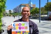 Man holding poster.
