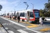 Streetcar passengers leaving train.