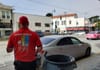 Man with garbage can.