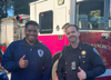 Two first responders give thumbs up.