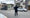 A police officer crossing a residential street.