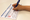 Person signing ballot.