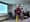 Man in front of a screen talks.