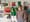 Man posing for picture with art in background.